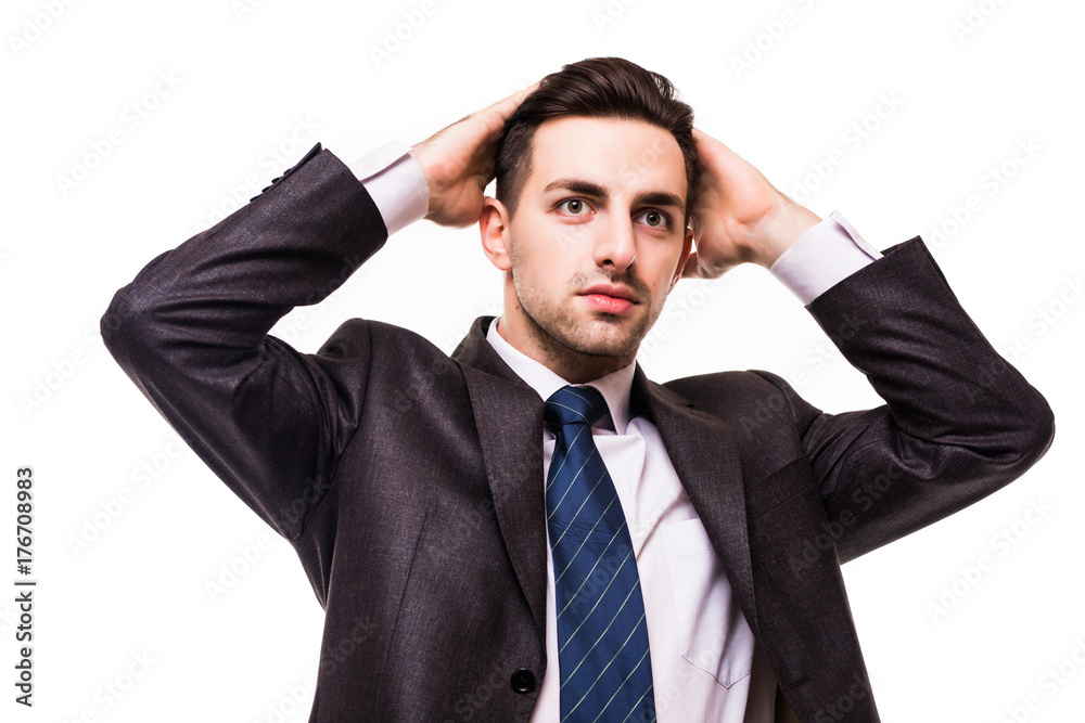 serious young businessman standing with hands crossed isolated on white serious young businessman standing with hands crossed isolated on white