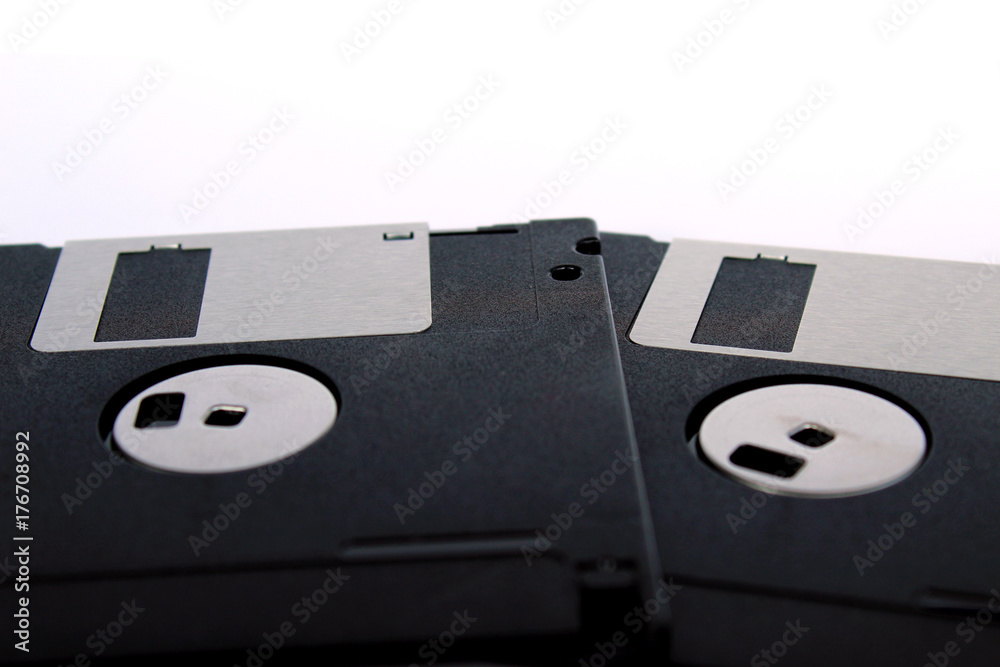 Detail of black floppy disks isolated on white background (back side) Detail of black floppy disks isolated on white background (back side)