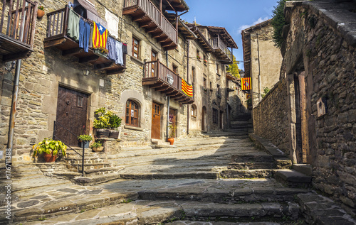 Old stone street in the medieval town of Rupit, Catalonia photo