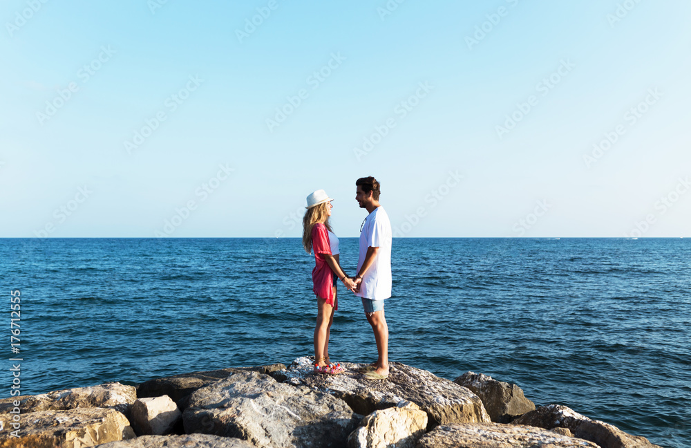 Happy young couple enjoying the day on the beach. Happy young couple enjoying the day on the beach.