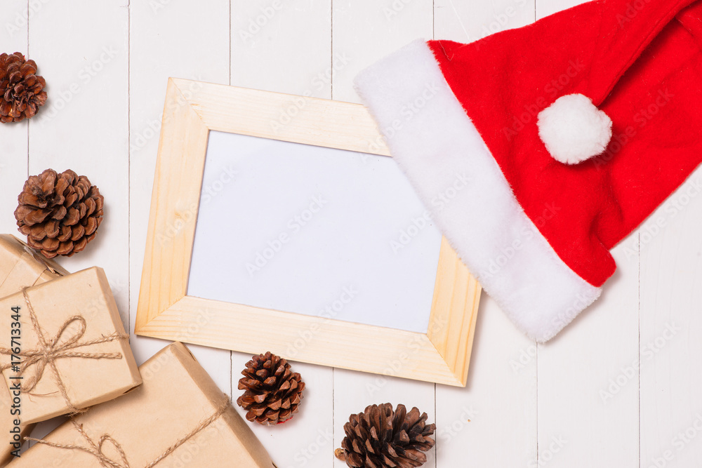 Christmas presents in decorative boxes on white wooden table background Christmas presents in decorative boxes on white wooden table background