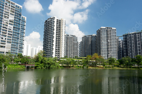 Canvas Print Lanscape view of condomium with trees near river