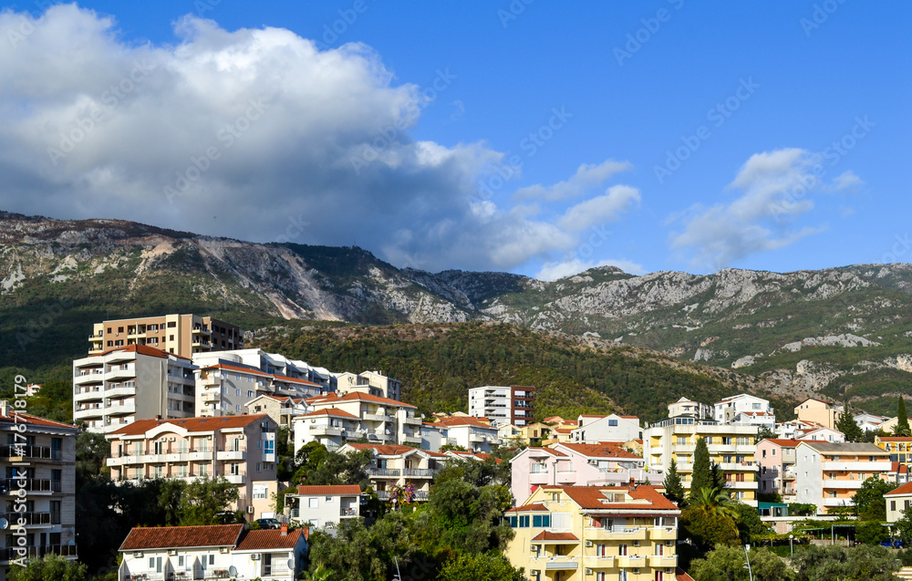 Coastal city at the foot of the mountain. Becici, Montenegro, View of the city and mountains