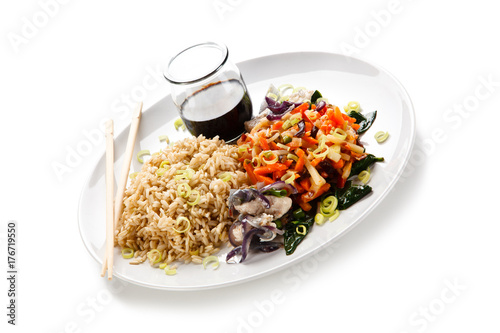 Rice dish with goulash on white background 