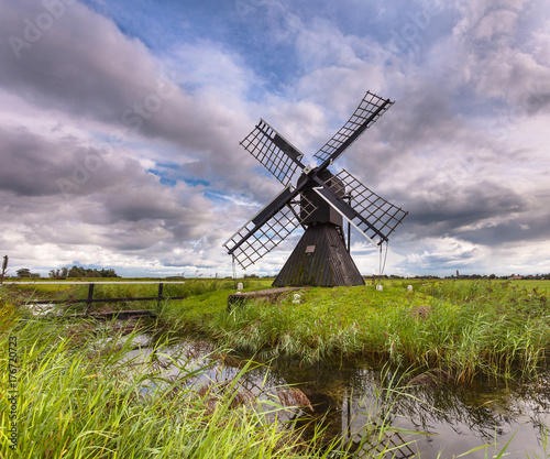 Wooden Windmill in Polder photo