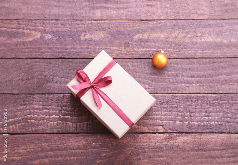 Gift boxes with bow on wood background Gift boxes with bow on wood background