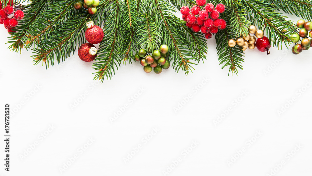 Christmas background with xmas tree and red berries on white wooden background. Merry christmas greeting card, frame, banner. Winter holiday theme. Happy New Year.