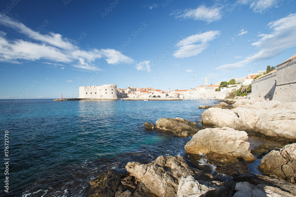 View of the fortress of St. John and the lighthouse from the stony beach. Dubrovnik, Croatia