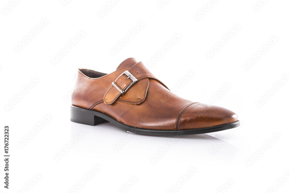 Close up of a brown men's monk shoes on white background with reflection