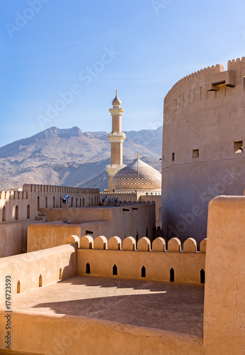 The Grand mosque and minaret in Nizwa viewed from the Nizwa fortress in Oman.