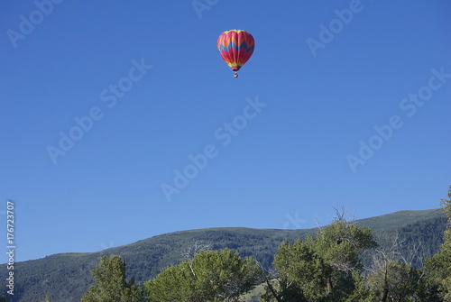 Hot Air Balloon Over Mountains