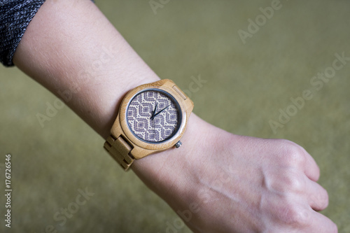 wooden watch on female hand