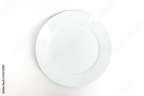 empty new ceramics plate on white background - top view