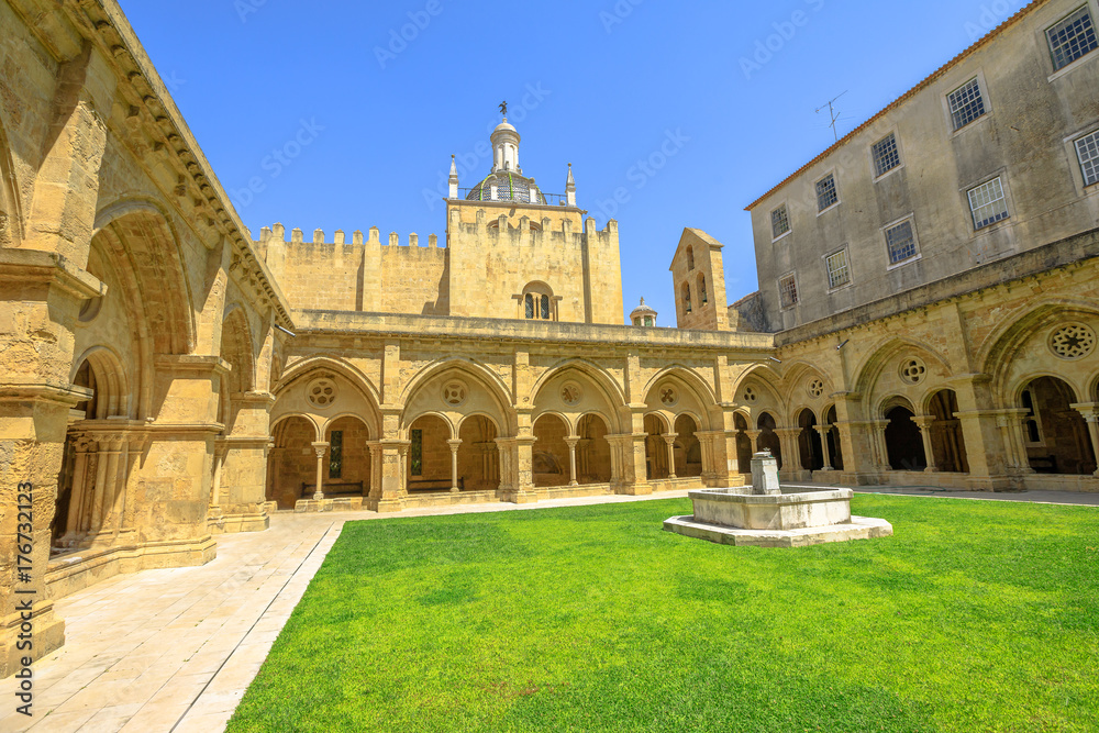Gothic romanesque cloister of old Coimbra Cathedral and dome. Se Velha de Coimbra, is one of most important romanesque buildings in Portugal and landmark in Coimbra, north of Portugal.