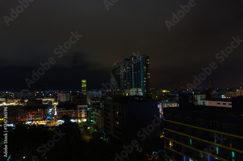 beautiful panorama landscape view of pattaya city at night after rain. cityscape at night with dark sky and cloud. business downtown city at night.