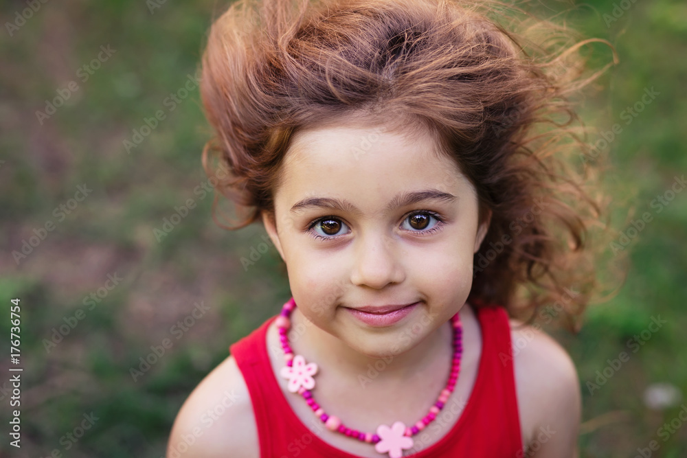 Portrait of cute little girl smiling outside Portrait of cute little girl smiling outside