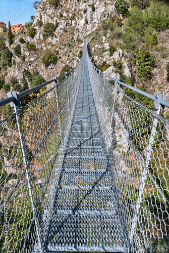 View on rope Tibetan steel bridge in mountain