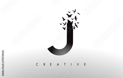 J Logo Letter with Flock of Birds Flying and Disintegrating from the Letter.