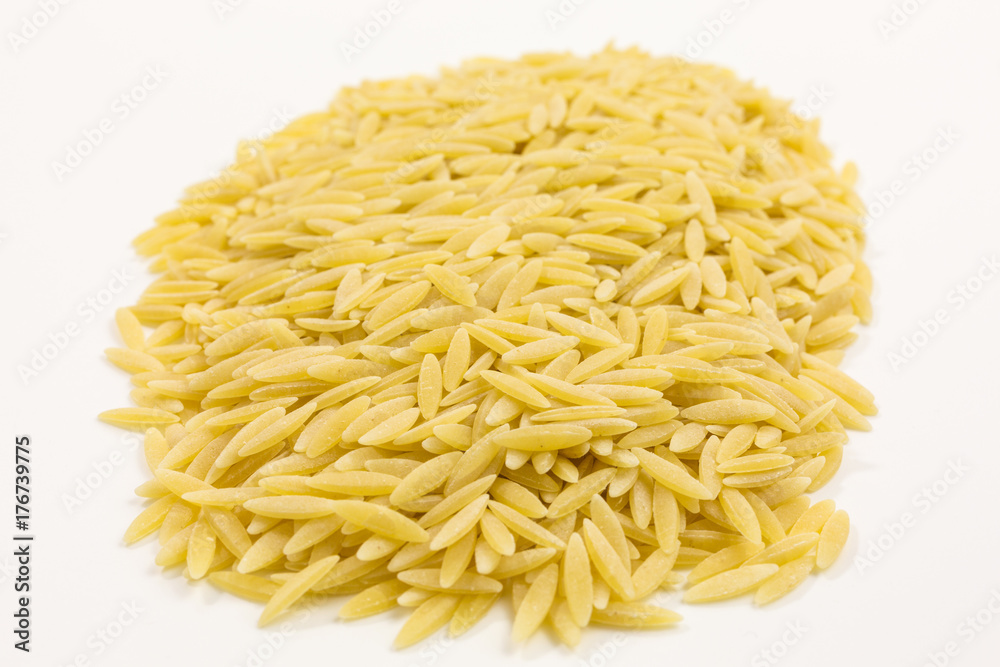 heap of uncooked greek kritharaki pasta heap of uncooked greek kritharaki pasta