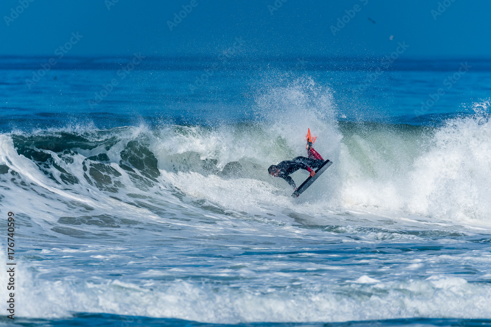 Bodyboarder surfing ocean wave