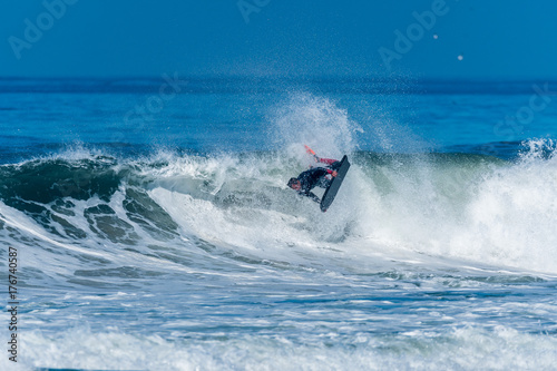 Bodyboarder surfing ocean wave