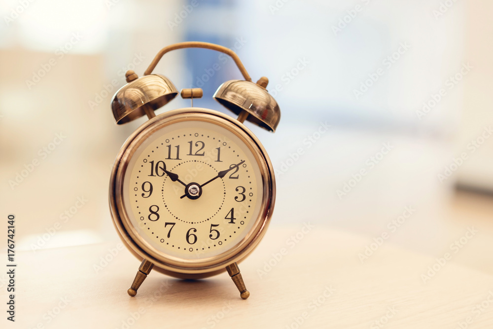 Retro alarm clock on table Retro alarm clock on table