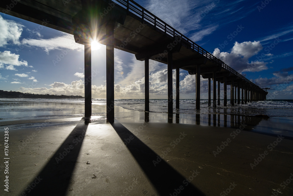 Scripps pier in San Diego, California against a cloudy sky