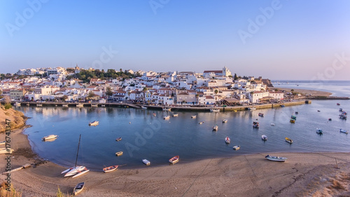 Aerial. Ferragudo at sunset shooting from sky with drone.