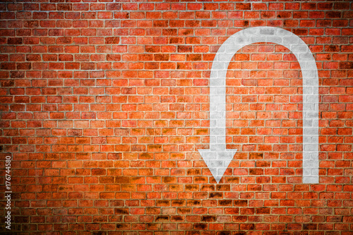 White U tune sign on vintage brick wall, decision making concept