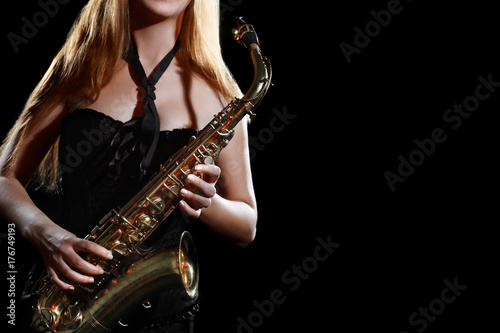 Saxophone player. Saxophonist woman musician with sax