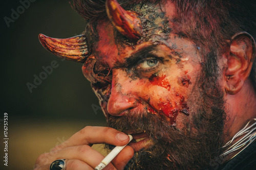 Photo Halloween devil smoking cigarette