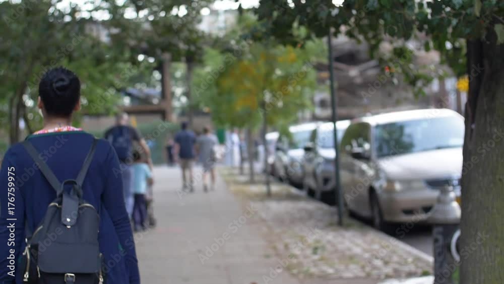 Girl walking down New York City sidewalk in slow motion Girl walking down New York City sidewalk in slow motion