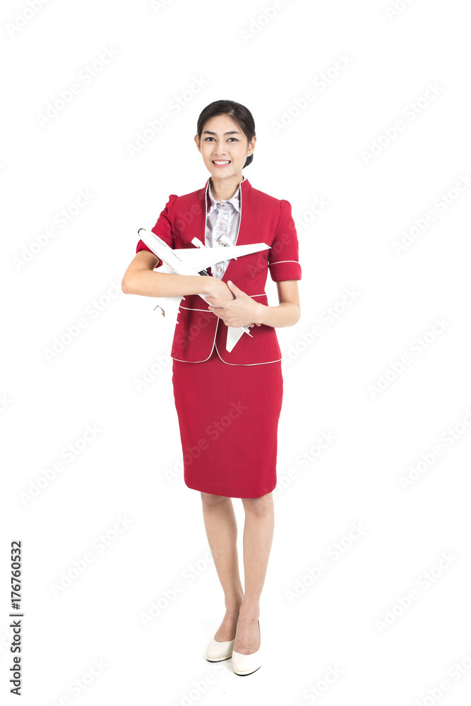 Portrait of Asian Air Hostess holding airplane model and passport with White background, Woman stand and smile at isolated on white background, Woman with Air Hostess concept. Portrait of Asian Air Hostess holding airplane model and passport with White background, Woman stand and smile at isolated on white background, Woman with Air Hostess concept.