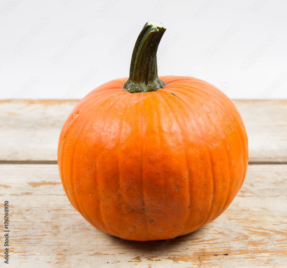 Obraz premium Pumpkin on a wooden background