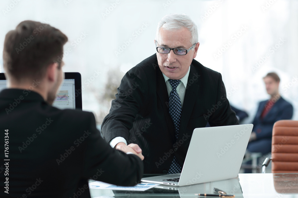 businessman welcomes business partner shaking hands businessman welcomes business partner shaking hands