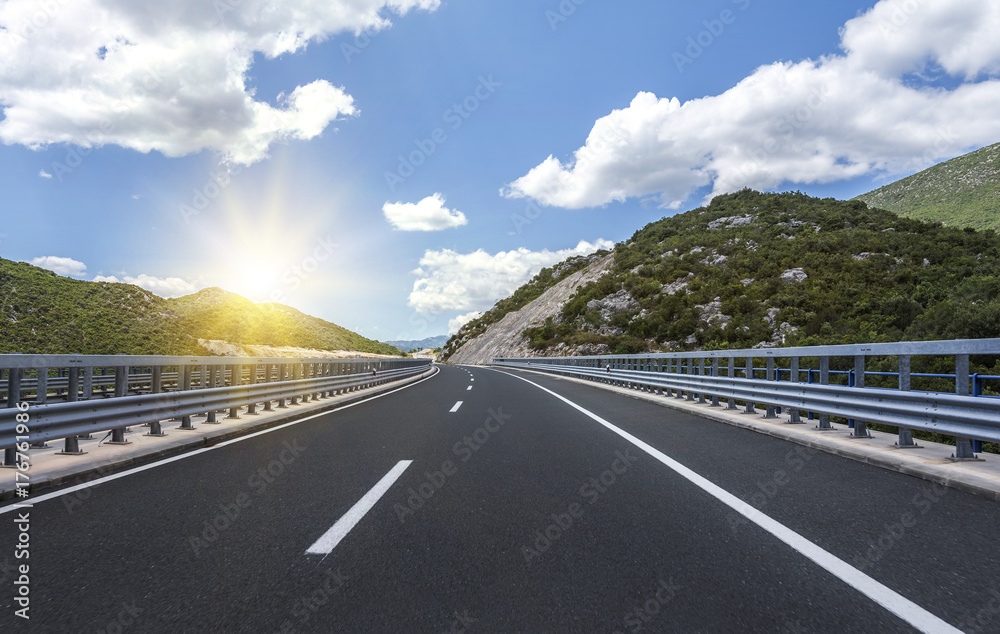 Fototapeta premium High-speed country road among the mountains.