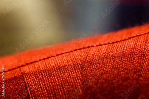 Sewing thread, handmade need background. © venars.original