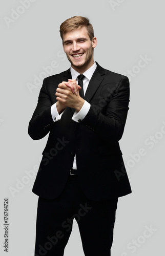 successful businessman making a welcoming gesture