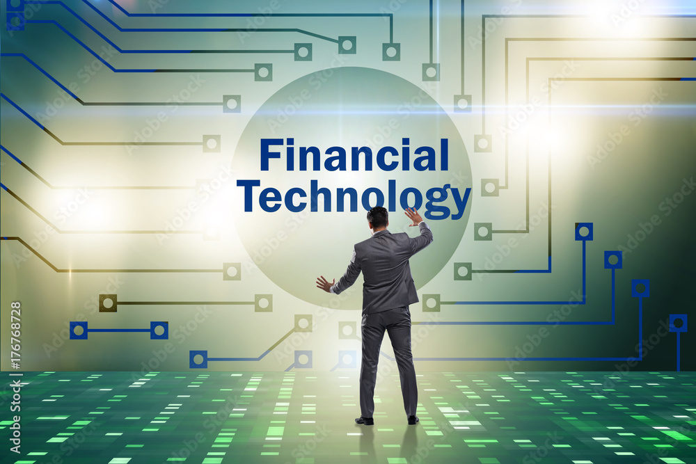 Businessman pressing buttons in fintech concept Businessman pressing buttons in fintech concept