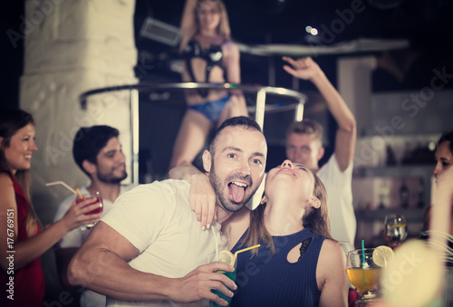 couple in the night club with drinks