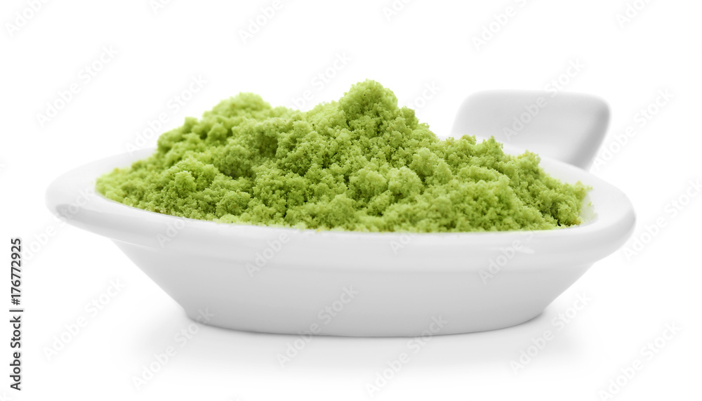Bowl with wheat grass powder on white background Bowl with wheat grass powder on white background