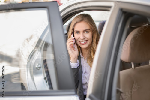 Young businesswoman talking on mobile phone in car © Africa Studio