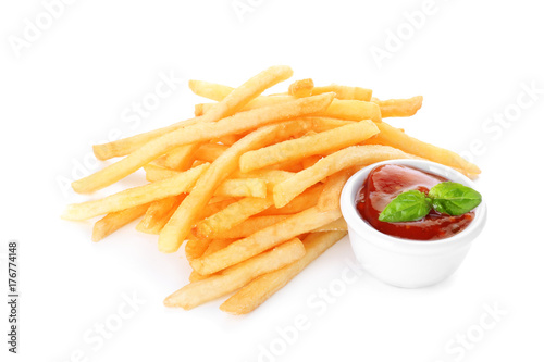 Yummy french fries with sauce on white background