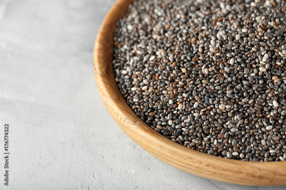 Bowl with chia seeds on table, closeup Bowl with chia seeds on table, closeup