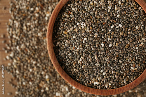 Bowl with chia seeds on table, closeup