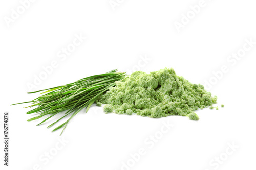 Wheat grass powder and sprouts, isolated on white