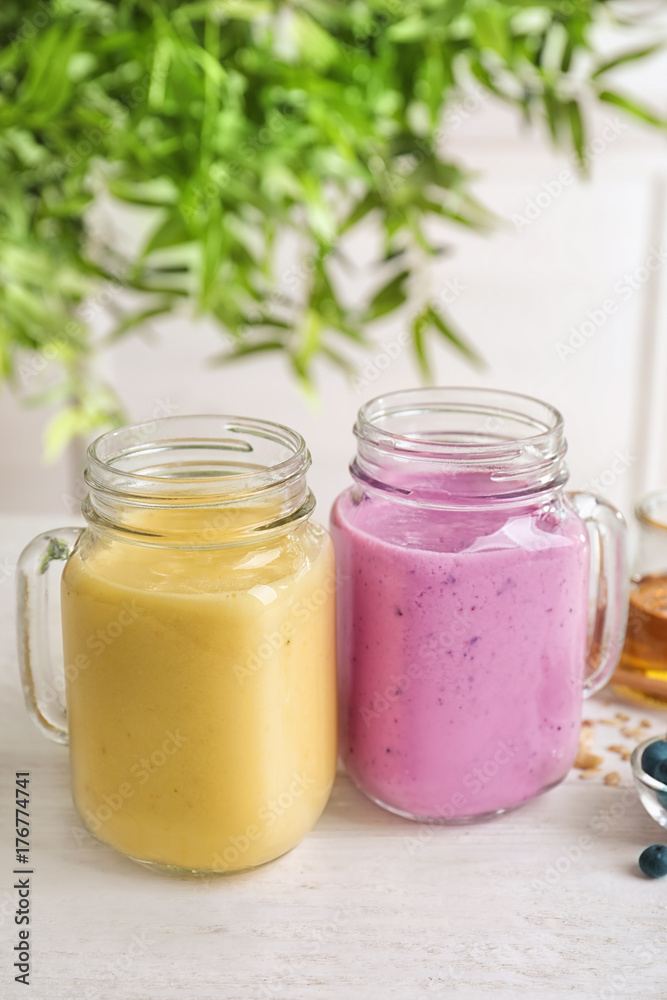 Jars with different protein shakes on table Jars with different protein shakes on table