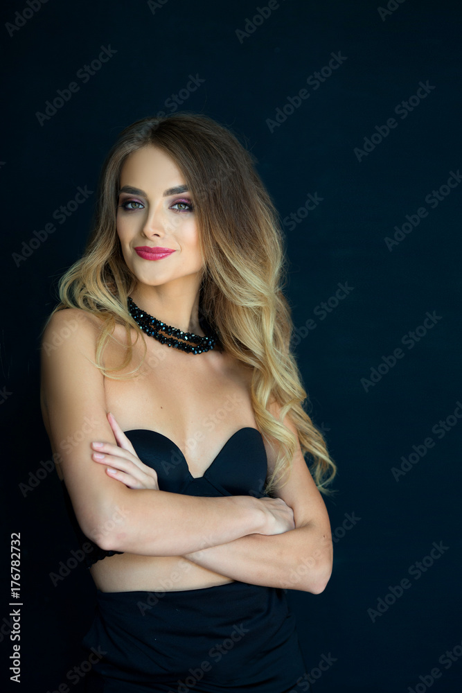 portrait of a smiling beautiful young girl with makeup and hairdress on head on a black background portrait of a smiling beautiful young girl with makeup and hairdress on head on a black background
