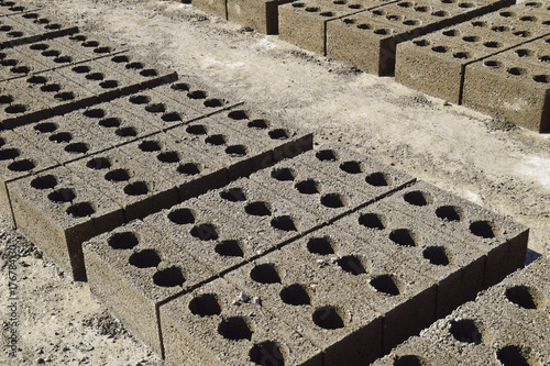 Cinder blocks lie on the ground and dried. on cinder block production plant. photo