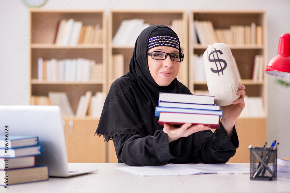 Muslim girl in hijab studying preparing for exams Muslim girl in hijab studying preparing for exams